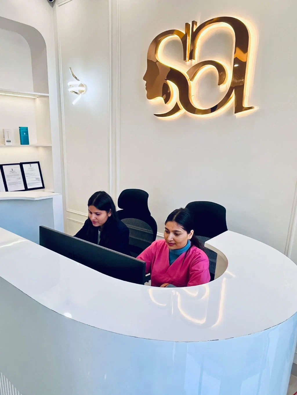 Welcoming reception desk at Dr. Shikha Aesthetics with friendly staff